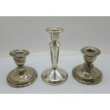 Three silver candlesticks, tallest 13cm, (the pair a/f, dented)