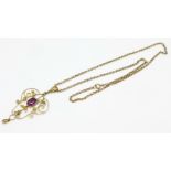 A 9ct gold, garnet and seed pearl pendant and chain, 4.8g, lacking seed pearls