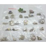 Twenty-five silver and silver mounted pendants and chains