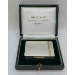 A silver and gold applied box, P.J. Doherty, London 2002, the box marked Gallagher, bears initials