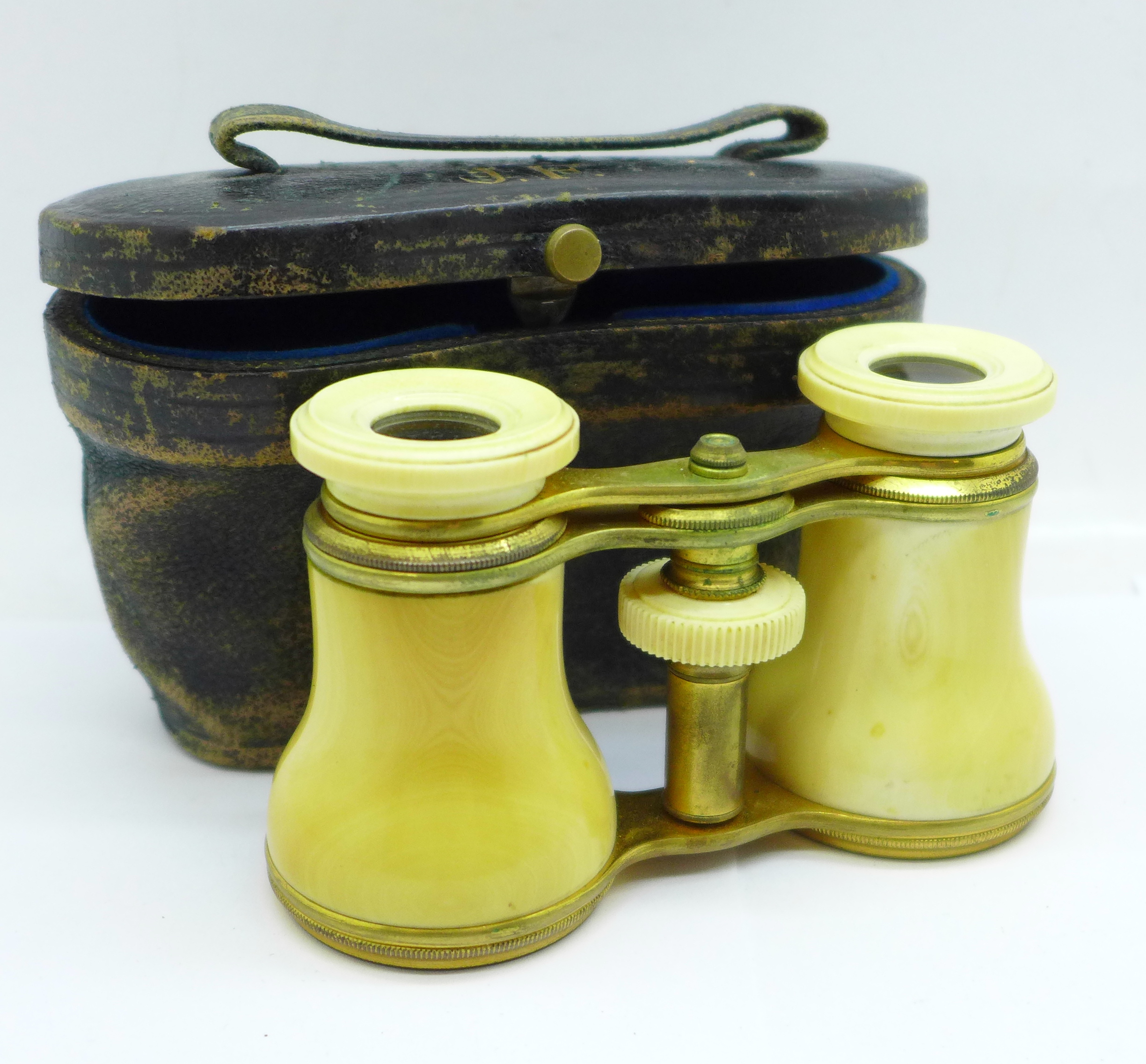 A pair of ivory opera glasses, cased, a/f