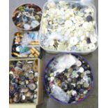 A large collection of vintage buttons, three tins and two boxes