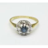 An 18ct gold, diamond and blue stone cluster ring, 2.8g, L