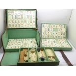 A leather cased Mahyong set, bone and bamboo pieces, the case marked Tien Yah Sheng Co., case handle