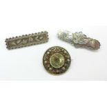 Two Victorian hallmarked silver brooches and a circular gilt metal thistle brooch