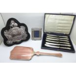 Four silver items; trophy shield hallmarked Birmingham 1904, hand mirror, enamel a/f, a small