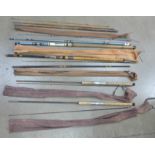 Five fishing rods including one marked Shakespeare