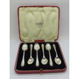 A set of six silver spoons, cased, 51g