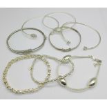 Five silver bangles, two silver bracelets and a white metal bracelet