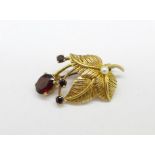 A 9ct gold, garnet and pearl brooch, 5.1g