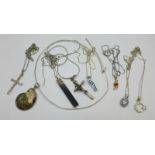 Seven silver pendants and chains