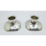 A pair of reversible candlesticks, marked Made In Denmark 90