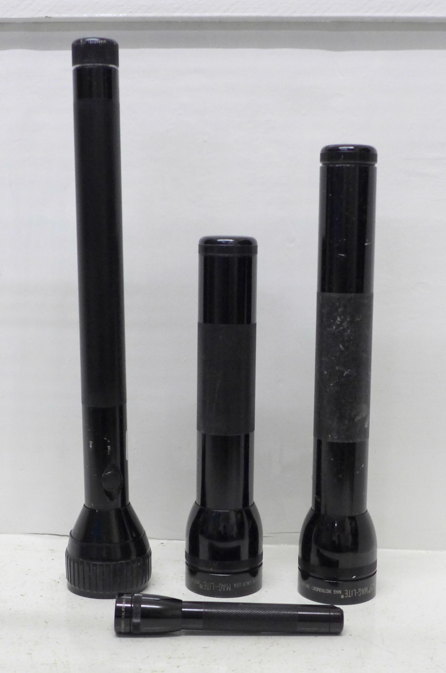 Three Mag-Lite torches and one other torch marked Edison, 14.5cm to 38cm