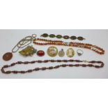 Costume jewellery including an Arts and Crafts brooch set with a carved jade leaf, not marked or