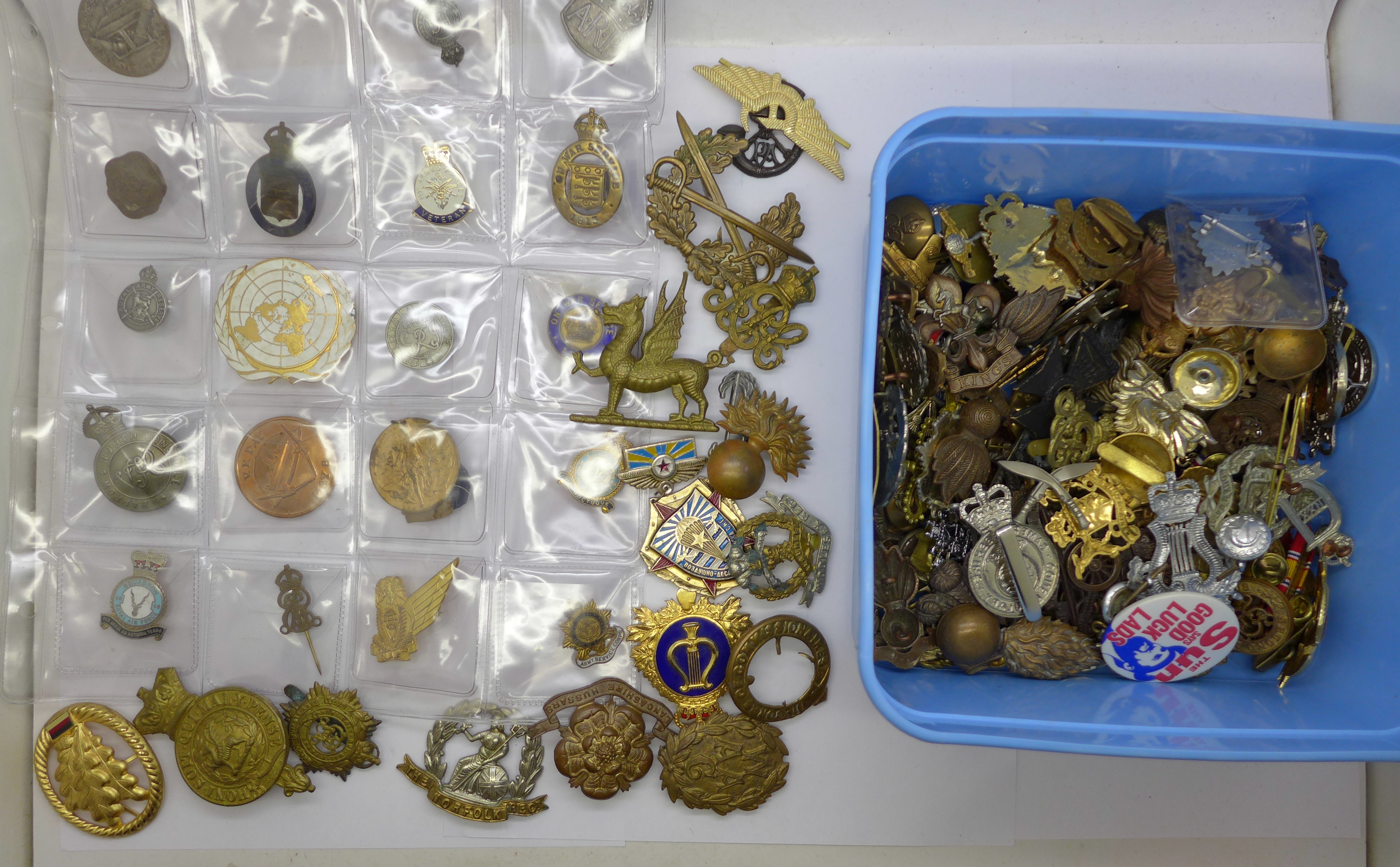 A collection of military badges and other badges including two tin aircraft badges, a silver ARP