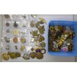 A collection of military badges and other badges including two tin aircraft badges, a silver ARP