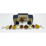 A large silver and amber ring, maker's mark PS, size O, and a silver bracelet set with tigers eye,