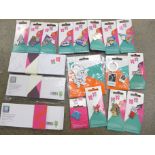 A collection of London 2012 Olympic badges and badge sets in cardboard folders