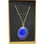 A 9ct gold and lapis lazuli pendant and chain, approximately 25mm x 18mm, total weight 6.9g
