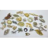 Thirty-two brooches