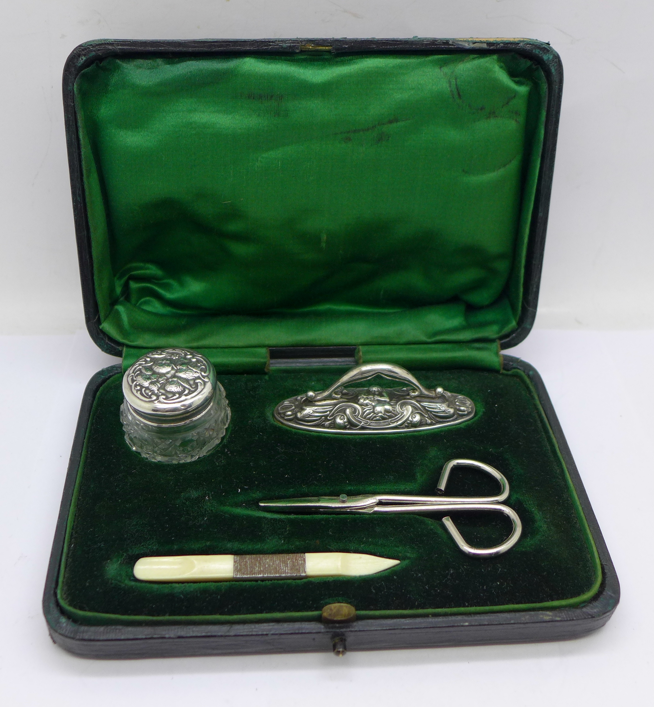 A silver mounted manicure set with associated scissors, Birmingham 1903 and 1907 hallmarks