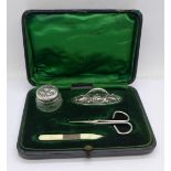 A silver mounted manicure set with associated scissors, Birmingham 1903 and 1907 hallmarks