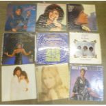 A collection of LP records including Shirley Bassey, Diana Ross, Barbra Streisand, Dionne Warwick