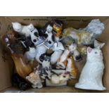 A collection of cat figures including a money box, salt and pepper shakers, resin figure etc.,