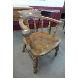 A Victorian elm and beech smokers bow chair