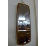 A teak framed mirror