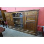 An Edward VII oak three door bookcase