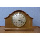 A mahogany mantel clock and an oak wall clock