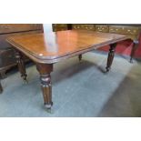 A Victorian mahogany extending dining table