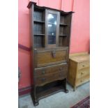 An Arts and Crafts bureau bookcase, manner of Ernest Archibald Taylor