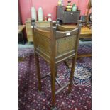 An Arts and Crafts inlaid oak jardiniere stand