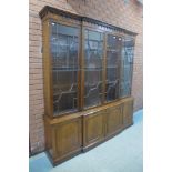 A large George III style mahogany astragal glazed breakfront library bookcase