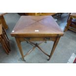 An Edward VII mahogany envelope card table, stamped W. Walker & Sons, Bunhill Row, London E.C.