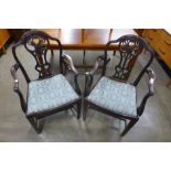 A pair of Chippendale Revival mahogany elbow chairs