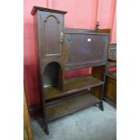 An Arts and Crafts oak bureau bookcase, manner of Liberty & Co.