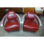 A pair of riveted aluminium and red leather aviator chairs