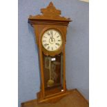 A carved beech gingerbread cased wall clock