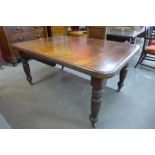 A Victorian mahogany extending dining table