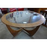 A G-Plan Astro teak and glass topped circular coffee table