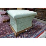 A Victorian mahogany and fabric upholstered ottoman