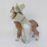 A Lladro figure, ?Platero and Marcelino? (ref 1181), designed by Juan Huerta in 1971 and retired