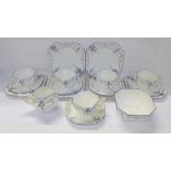 A Shelley Blue Iris Queen Anne six setting tea set with cream and sugar, lacking one cup and saucer,