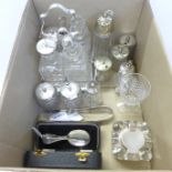 A four bottle cruet on a plated stand, other condiments, an inkwell, etc.