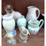 Four items of Radford pottery, pitcher, jug, vase and bird vase, a figure of bird, a Babbacombe