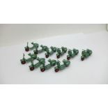 Ten Benbros Mighty Midgets model Vespa scooters, in metallic green with red hubs