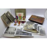 A tin of six WWII medals with an album of North Africa campaign photographs and a British Army of